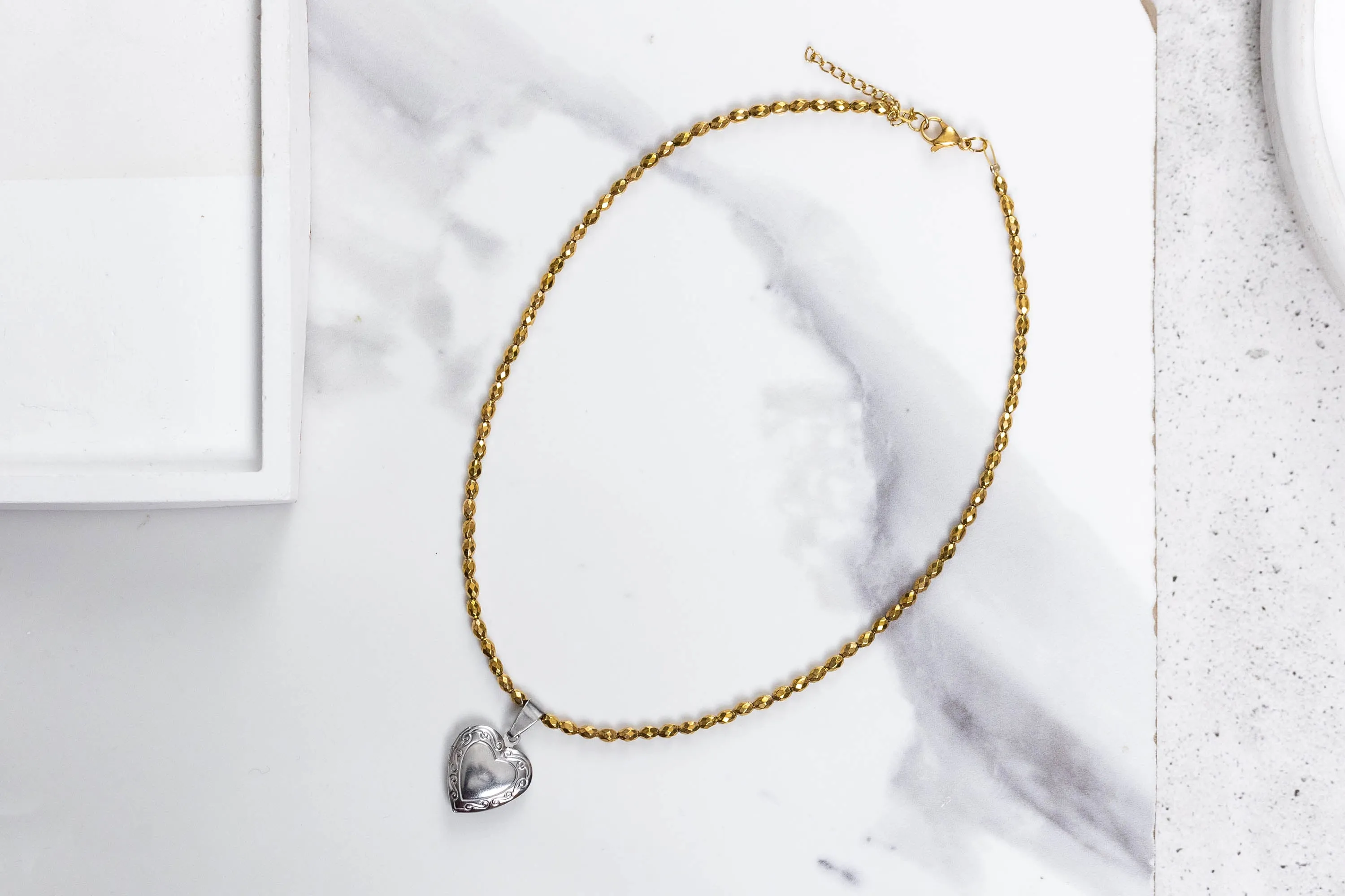 Gold hemate and heart locker